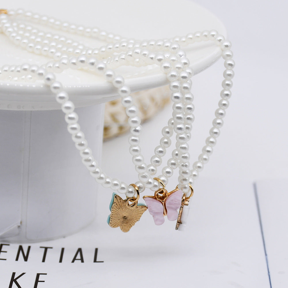 Collier ras du cou élégant en perles blanches et petites perles rondes pour mariage